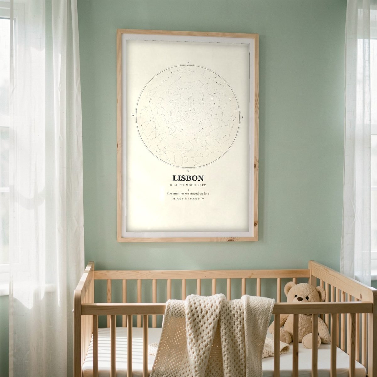 Mockup: a cream Ink-style Skynolie star map in a pale wood frame above a crib